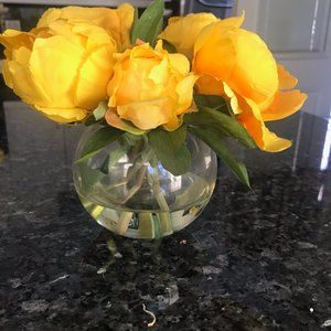 Faux Yellow flowers in glass vase